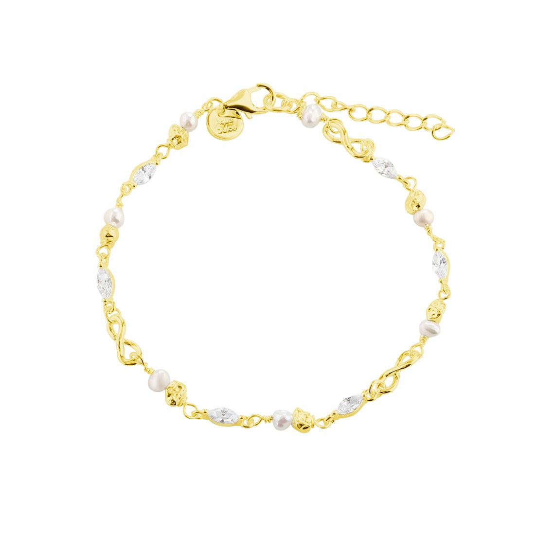Aqua Dulce White Garden Armband vergoldet mit kleinen weißen Perlen und facettierten Steinen, Modell 5968-1.
