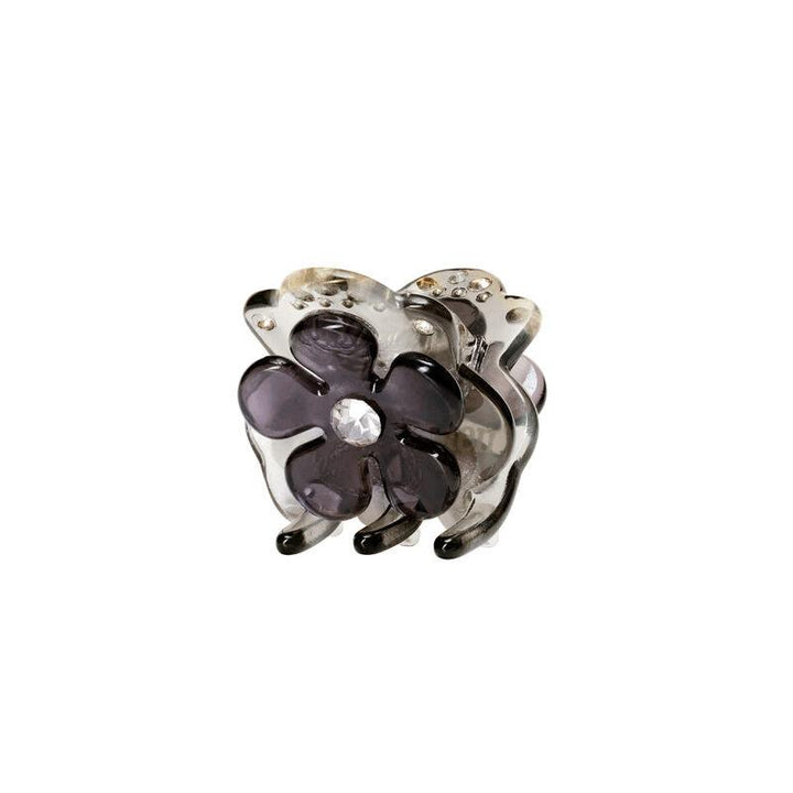 maanesten-kalina-fog-hairclaw zeigt eine dekorative Haarspange mit lila Blume und klarem Stein vorne. Modell 3834