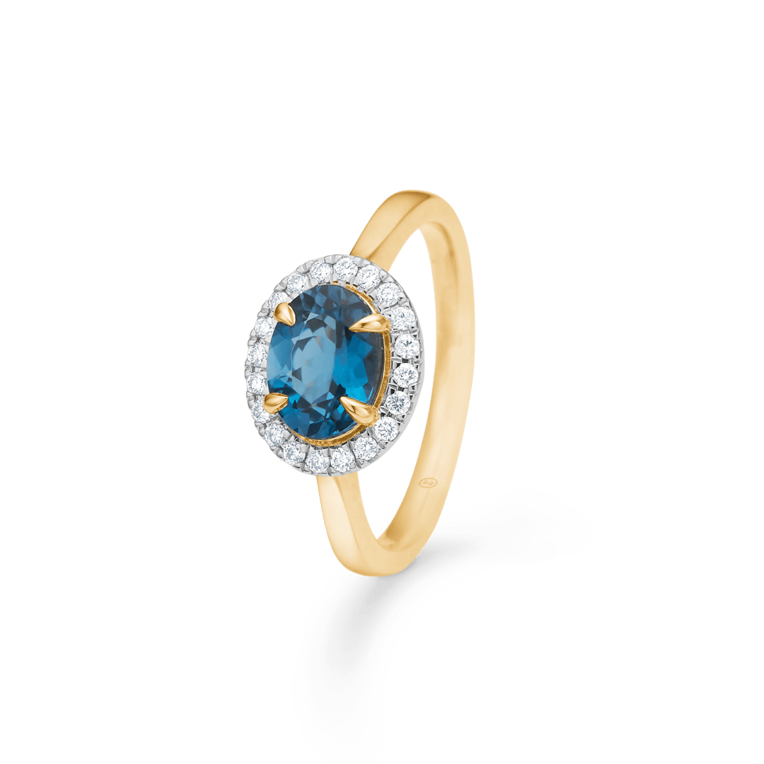 Verlobungsring aus 14 kt Gold mit blauem Topas und Diamanten