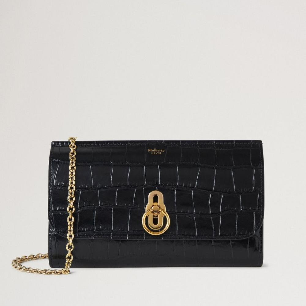 Mulberry Amberley Clutch Black Shiny Small Croc, elegante schwarze Clutch aus glänzendem Leder mit Krokodilprägung, goldener Kette und Drehverschluss. Modell RL8191641A100.