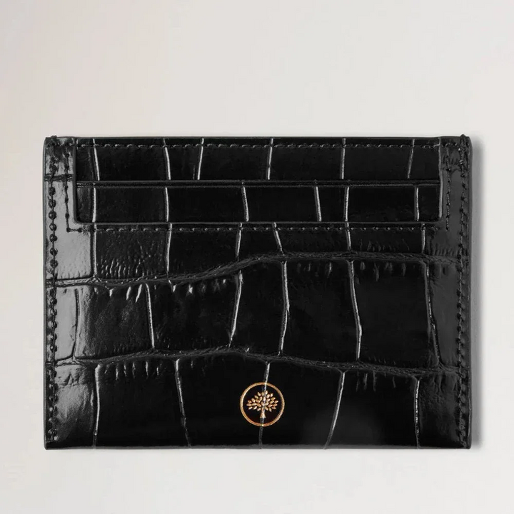 Mulberry Das Credit Card Slip Black Shiny Small Croc präsentiert ein schlankes Kartenetui aus schwarzem, glänzendem Krokoleder. Modell RL8748641A100.