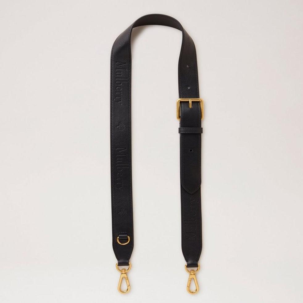 Mulberry Lederarmband mit geprägtem Logo aus schwarzem Leder mit verstellbarer Schnalle und goldenen Metallteilen. Modell RX0284587A100.