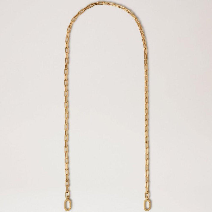 Mulberry Softie Chain Umhängetasche aus glänzendem messingfarbenem Metall, elegante Kette vor hellem Hintergrund. Modell RX0289000N188