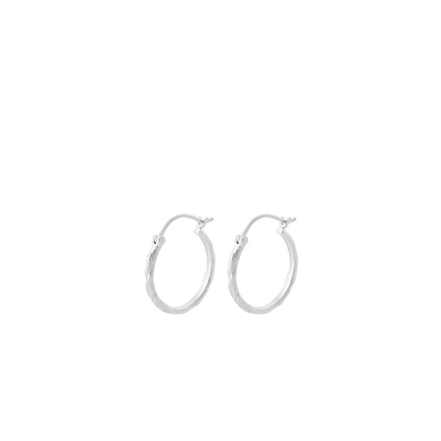 Pernille Corydon Small Ice creoles in silver, two simple round earrings on a white background. Modell E-236-S