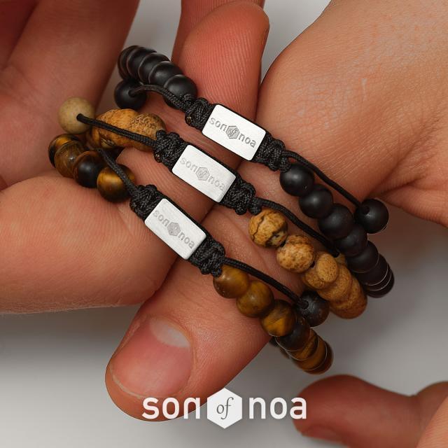son of noa stone bracelet with matte and brown pearls and silver details on the hand. Modell 80980010000