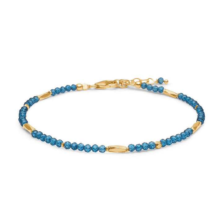 studio-z-evergreen-bracelet-with-london-blue-topaz als zartes Armband mit blauen Edelsteinen und goldenen Details. Modell 8256851