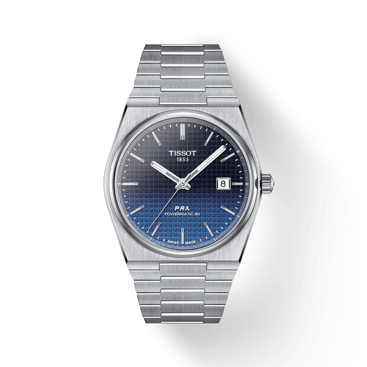 Die Tissot PRX Powermatic 80 40 mm verfügt über ein blaues Farbverlaufszifferblatt, ein Stahlarmband und eine Datumsanzeige. Modell T1374071105101