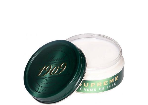 Collonil Supreme Creme Neutral dargestellt als rundes, offenes Glas mit grünem Deckel und weißer Creme. Modell 79540000050